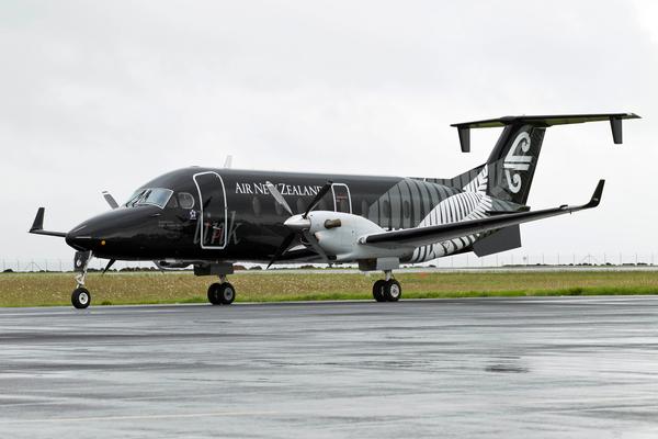 Air NZ Beech 1900 black - on ground.